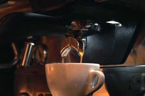 A cup of Joe making by An under-cabinet coffee maker