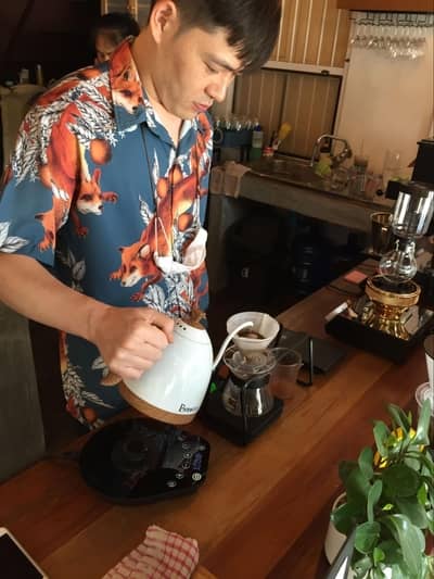  A barista making Hario V60 coffee