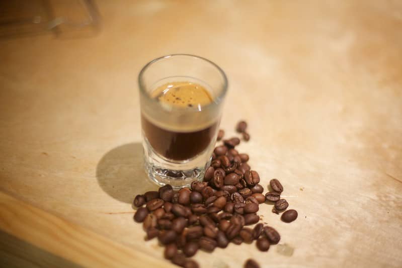 A shot of Blonde espresso and Blonde roast beans