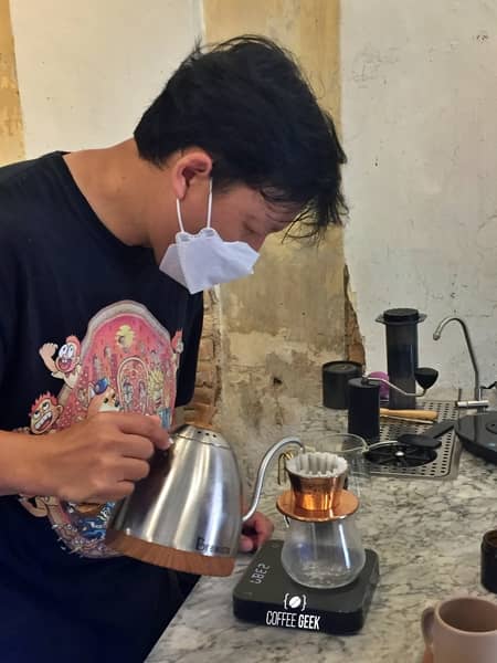 A barista making Pour-Over coffee