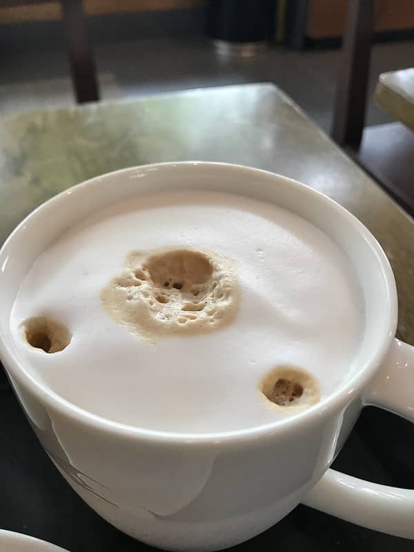 An iced espresso with cold foam