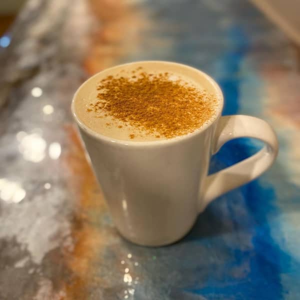 Closeup of a Starbucks Brown Sugar Oat Milk Latte in a white mug