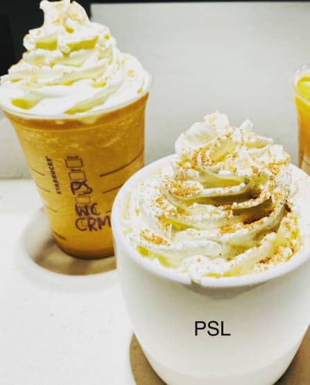Closeup of hot and cold versions of Starbucks Pumpkin Spice Lattes