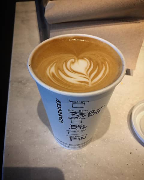 Flat White in a branded Starbucks to_go cup