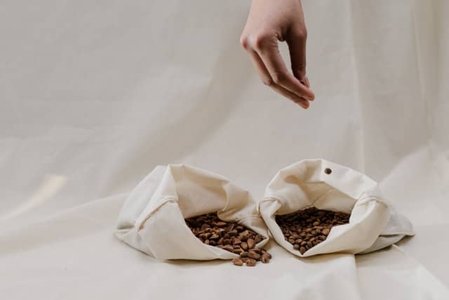 How to open coffee bag seals: Whole beans stored in a pair of open white bags