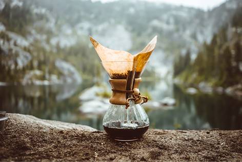 Chemex coffee maker on a rock in mountains