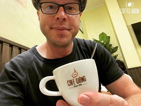 Tim is drinking Vietnamese coffee at Cafe Giang, Hanoi, Vietnam