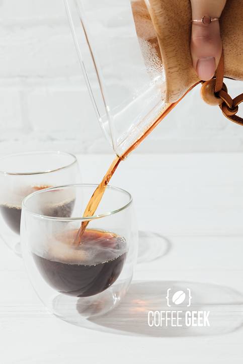 Pouring alternative coffee from Chemex into glass mug