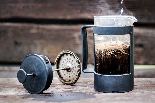 Hot water plus coffee grounds in a French press