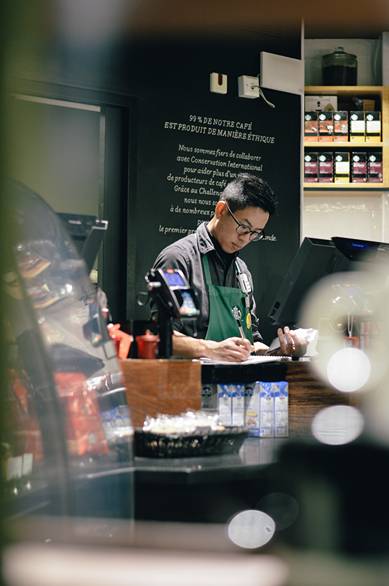 A barista working at the desk