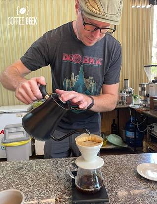 A man pouring coffee