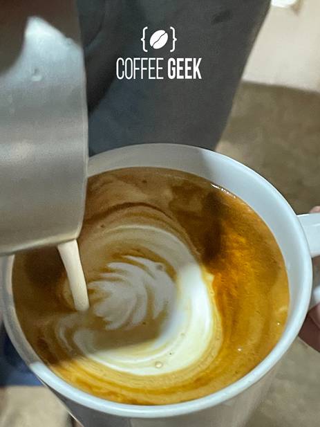 Adding steam milk to coffee
