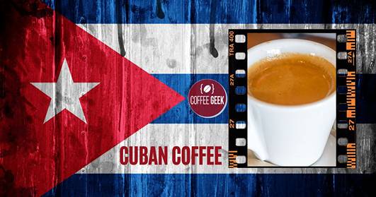 A cup of coffee with a cuban flag on it.
