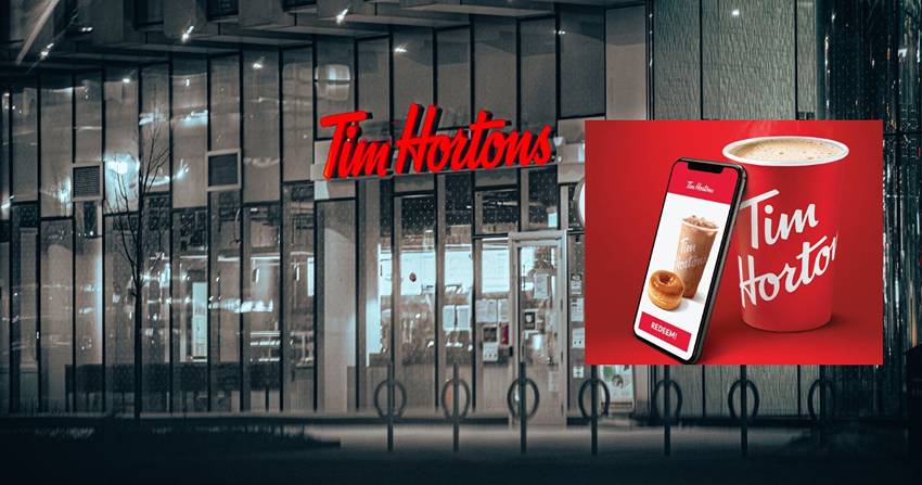 A tim hortons coffee shop with a phone in front of it.