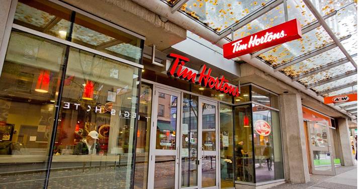 The entrance to a tim horton's store in vancouver.