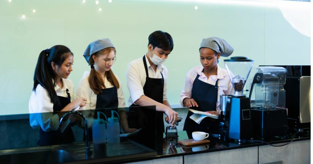 A group of women working at a coffee shop.